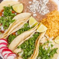 Taco Combo (4 Tacos) · Served with rice and beans.