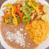 Fajitas · Served with rice and beans.