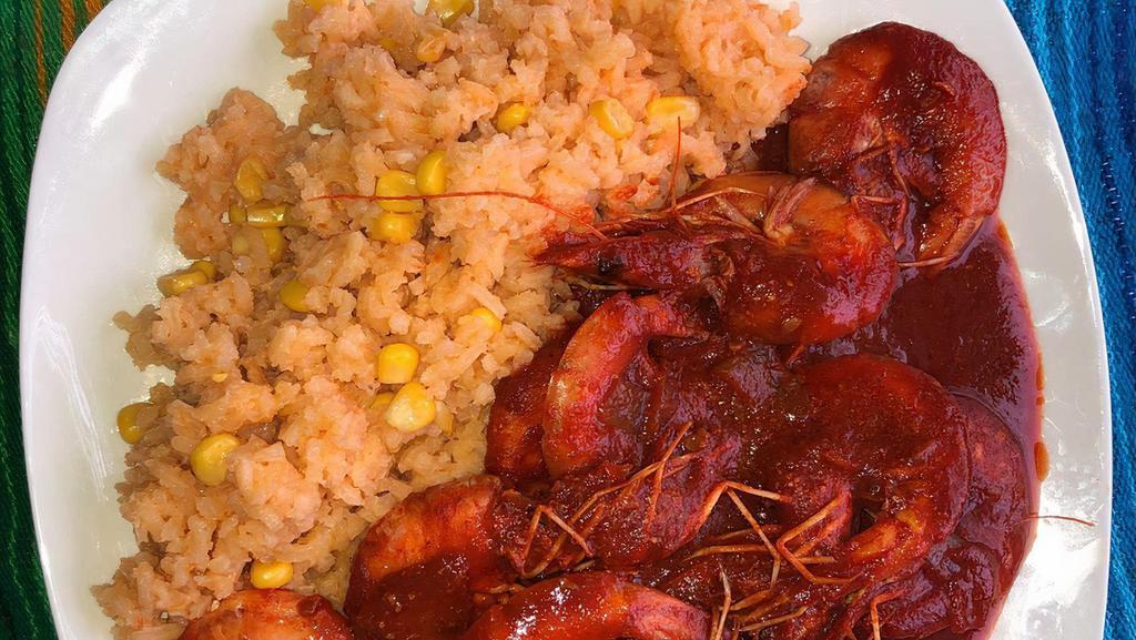 Camarones A La Diabla · Spicy (devil)shrimps served with rice and beans.