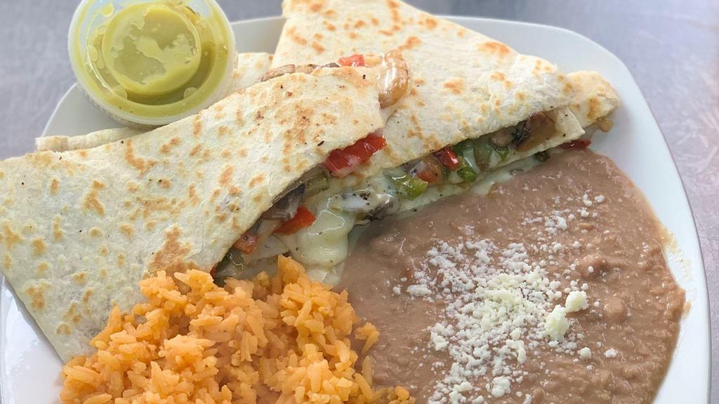 Veggie Quesadilla  · Mushrooms, peppers,onions.
Served with rice & beans.