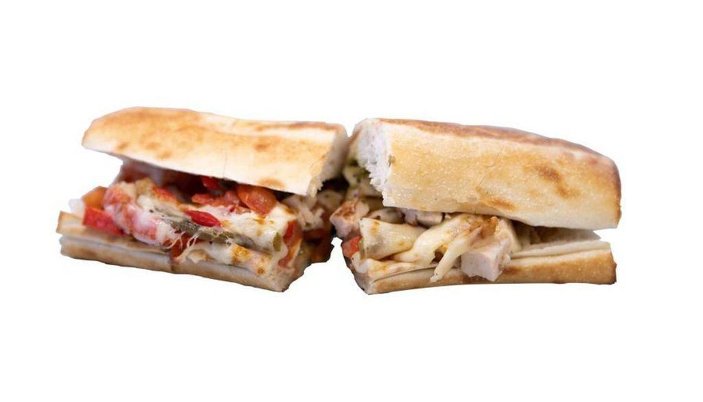 Chicken Pesto · Oven-roasted chicken breast, sweet basil pesto, roasted red peppers, balsamic Roma tomatoes, and mozzarella.