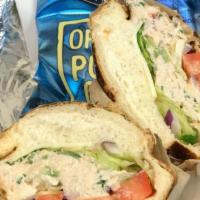 Tuna · Made from scratch tuna salad, lettuce, tomato, red onions, and provolone cheese. Contains ch...