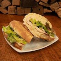 Turkey Caesar Sandwich · Oven-roasted turkey, hearts of romaine, shaved parmesan cheese. tossed with caesar dressing.