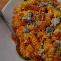 Buffalo Chicken Pasta · Spiral Macaroni with our house-made cheese recipe mixed with Frank's Buffalo sauce, oven-roa...