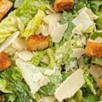 Caesar Salad · Hearts of Romaine, Shaved Parmesan Cheese and Croutons, Tossed with Classic Caesar Dressing.