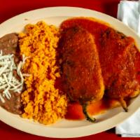 Chilles Rellenos (2) · Two poblano peppers stuffed with cheese and served with rice and beans.