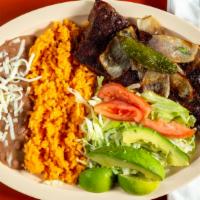 Carne Asada Specialty · Skirt steak with rice, bean, salad and tortillas.