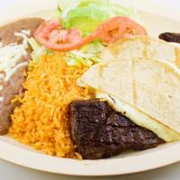Bistec A La Timpiquena Specialty · Tender skirt steak, cheese quesadillas, rice and beans.