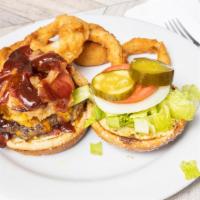 Western Pourman · Fill up with a burger that is topped with bacon, onion straws, cheddar cheese and a sweet BB...