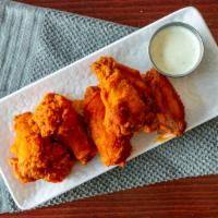 Main Street Wings · Choose from our seven home made sauces: mild, hot 'n spicy, BBQ, mango habanero, garlic parm...