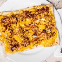 Southern Pulled Chicken · BBQ chicken, this flatbread is topped with creamy mac 'n' cheese, red onion, bacon and chedd...
