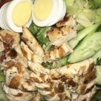 Buffalo Chicken Salad · Grilled or fried chicken mixed with buffalo sauce, on a bed of greens with tomatoes, cucumbe...