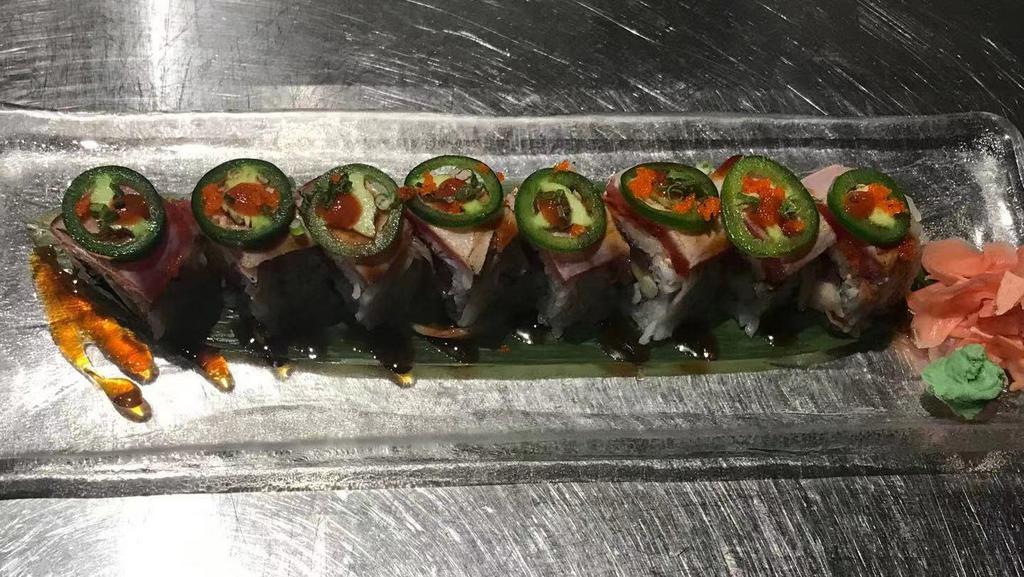 24 Waynes Roll · fresh salmon, tuna ,yellowtail,white tuna,cucumber topped with marinated crabmeat,seared tuna,jalapeno,chef sauce