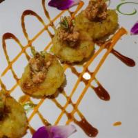 Dancing Scallop · Deep-fried scallops topped with spicy crabmeat, eel sauce, and spicy mayo.