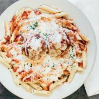 Baked Mostaccioli · Mostaccioli with sauce and two meatballs, loaded with mozzarella cheese.