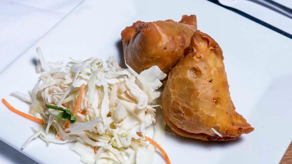 Veg Samosa (2 Pc) · Hand roll pastries stuffed with potato and onion.