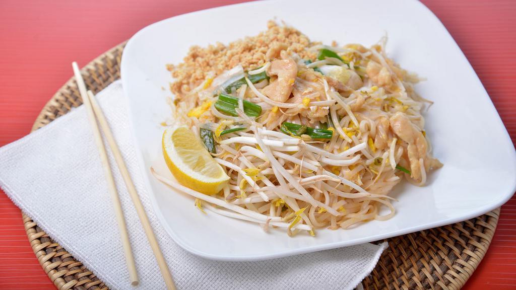 Pad Thai · Gluten-free. Sautéed rice noodles with eggs, beansprouts, and green onions, topped with crushed peanuts, raw beansprouts, and lemon.