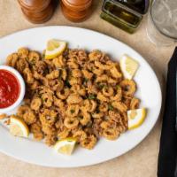 Calamari · 1/2 lb. of fried calamari with marinara sauce and lemon wedge.