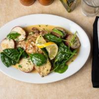 Chicken Limone · Chicken breast sauteed in a lemon butter sauce. Served with spinach and roasted potatoes.