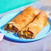 Saag Paneer Dosa · Paneer cooked with fresh chopped spinach rolled in a fluffy dosa.