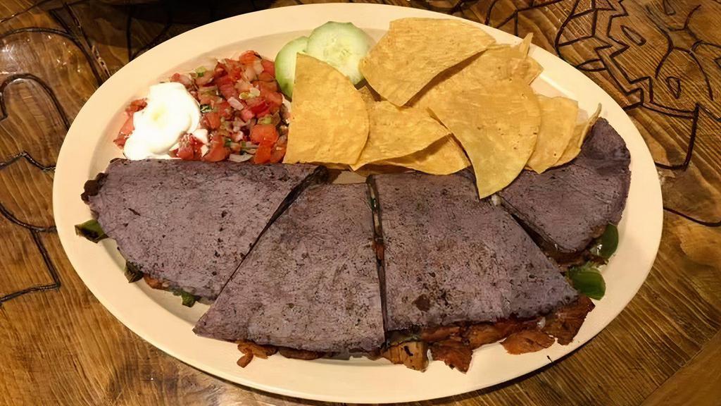 La Chula · Large quesadilla in homemade blue corn tortilla, stuffed with grill mix cheese peppers, and onions, on side sour cream, pico de gallo with chips.