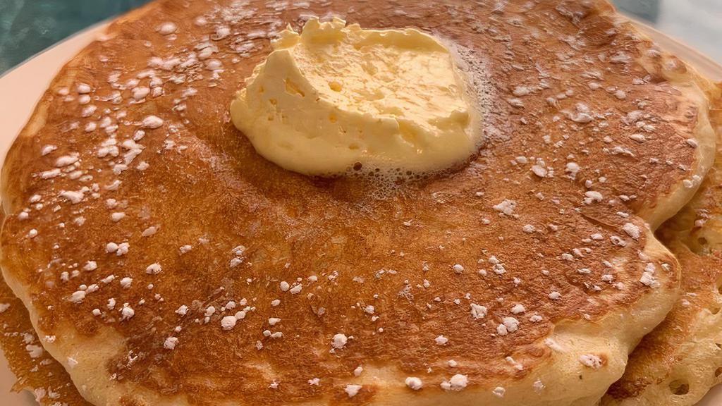 Buttermilk Pancakes · Topped with powdered sugar & served with warm maple syrup & butter.