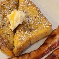 French Toast · Topped with powdered sugar & served with warm maple syrup & butter.