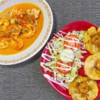 Plato Caribeno · Fish fillet, cooked shrimp, house special sauce, served with rice, salad, and patacones.