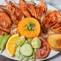 Camarones A La Plancha · Grilled shrimp and sauteed onions served with side of rice.