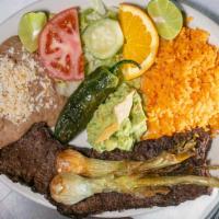Carne Asada · Grilled skirt steak with green onions. Rice and beans and your choice of tortillas Corn or F...
