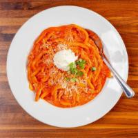 Eight Finger Cavatelli · Spicy vodka sauce, whipped ricotta, basil.