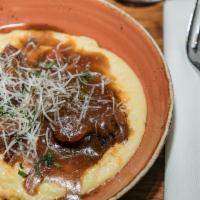 Braciole · Braised short rib, red wine demiglace, cheesy polenta.