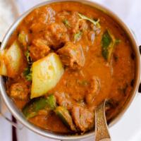 Lamb Rogan Josh · Boneless cubed lamb cooked in a yogurt based sauce made with tomatoes, onions, spices, and r...