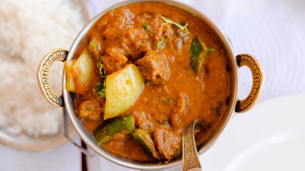Lamb Rogan Josh · Boneless cubed lamb cooked in a yogurt based sauce made with tomatoes, onions, spices, and raisins.
