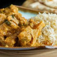 Goat Korma · Tender pieces of richly seasoned goat cooked in a creamy sauce hinted with spices, cashew nu...