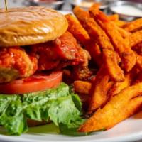 *Buffalo Chicken Sandwich · Tender hand breaded chicken breast layered with buffalo sauce, ranch dressing, lettuce, toma...