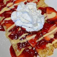 Strawberries & Cream Crêpe · Crêpes topped with fresh strawberries, a strawberry compote, whipped cream and a drizzle of ...