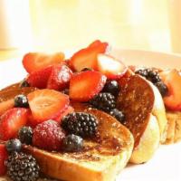 Belgian Waffle · Simply served with butter and maple syrup. Add fresh blueberries, strawberries, bananas or c...