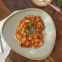 Fettucine Bolognese · Fettucine pasta, bolognese meat sauce, homemade fresh mozzarella.