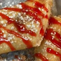 Cheesecake Burrito · Deep fried tortilla shell with a cheesecake middle. Choice of topping