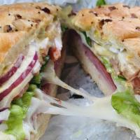 Triple Cheese Sub · American, swiss and provolone cheese, lettuce, tomato, onion, pickle, mustard, and mayonnais...