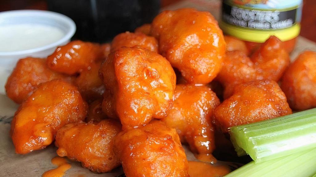 Buffalo Cauliflower · NEW!!!  A generous portion of fried cauliflower shaken in your choice of wing sauce. Served with celery and a side of bleu cheese or ranch.