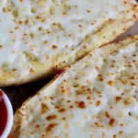 Cheesy Garlic Bread · Oven-baked with a blend of melted Italian cheeses and our homemade marinara.