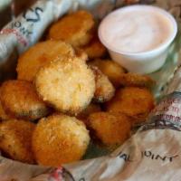 Fried Pickles · Breaded Pickle Chips with homemade Ranch Dressing.