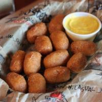 Mini Corn Dogs · Mini Corn Dogs served with a side of mustard.