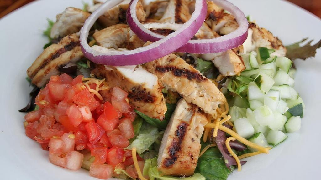 Grilled Chicken Salad - Full · Fresh-grilled chicken over mixed lettuce,cheddar cheese, cucumbers, red onions and tomatoes.