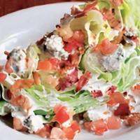 Wedgie Salad · Iceberg wedge drizzled with yourfavorite salad dressing. Topped withbleu cheese crumbles, ba...