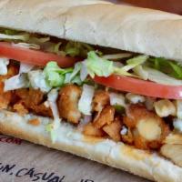 Buffalo Chicken Sub · Fried chicken covered in Roosters Medium wing sauce with celery, lettuce, tomatoes and chees...