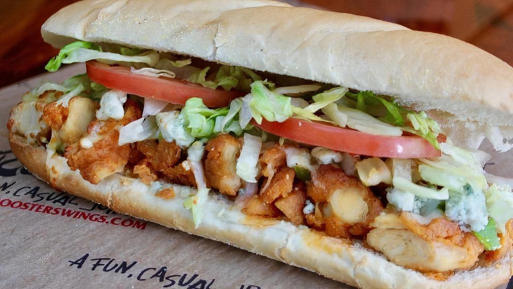 Buffalo Chicken Sub · Fried chicken covered in Roosters Medium wing sauce with celery, lettuce, tomatoes and cheese. Topped with bleu cheese crumbles.