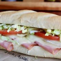 Ham & Swiss Sub · Smoked ham, lettuce and tomatoes covered with melted Swiss and a blend of mozzarella and pro...